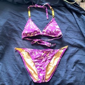 Victoria’s Secret purple and white floral bikini with gold metal accents. Size M